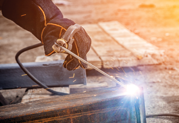 3 A skilled welder working on a metal box