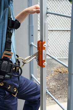 A Rigid Rail System with a man attached to it via carabiner.