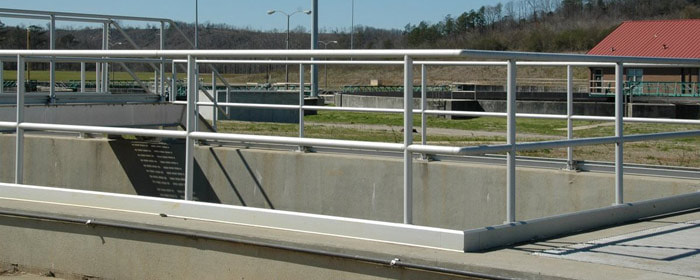 An OSHA compliant handrail at a wastewater treatment plant.